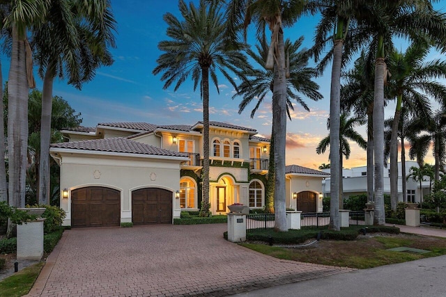 mediterranean / spanish-style house featuring a balcony