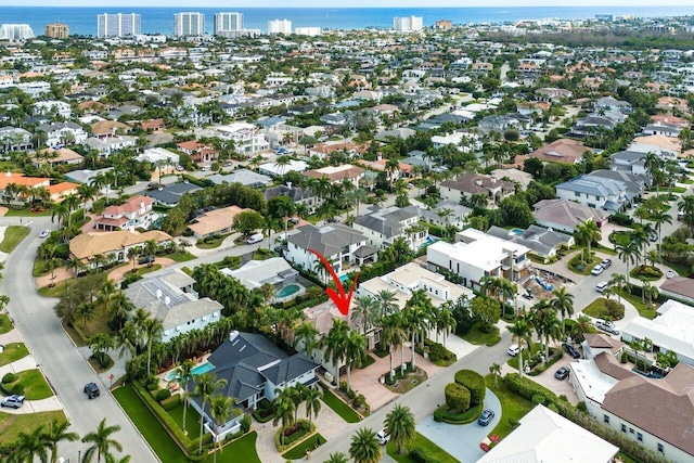 birds eye view of property featuring a water view