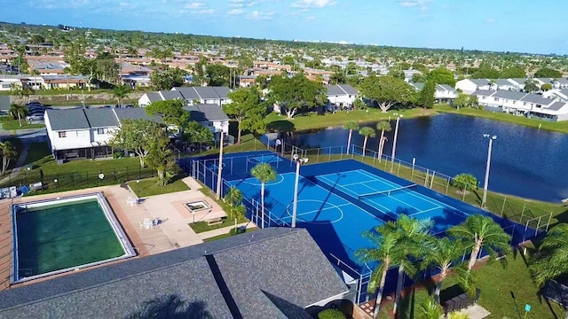 birds eye view of property with a water view