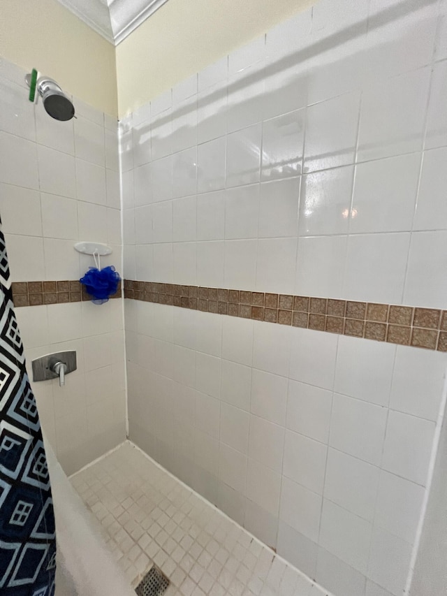 bathroom with a tile shower