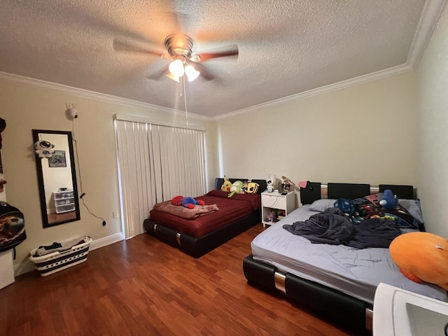 bedroom featuring ceiling fan, ornamental molding, a textured ceiling, and hardwood / wood-style floors