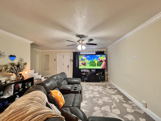 living room featuring ceiling fan, crown molding, and a textured ceiling