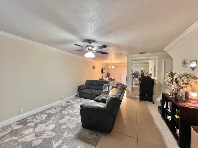 tiled living room with a textured ceiling, ornamental molding, and ceiling fan with notable chandelier