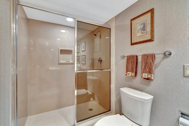 bathroom with walk in shower and toilet