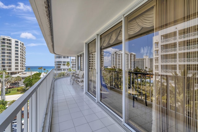 balcony featuring a water view