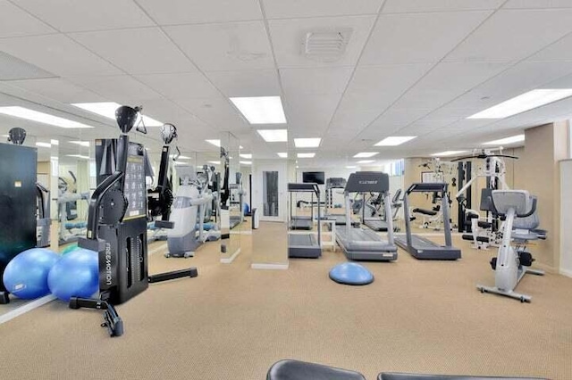 gym featuring a drop ceiling