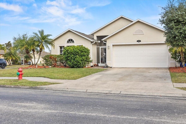 ranch-style home featuring a front yard and a garage