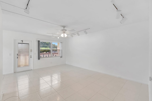 351 Preston I, Boca Raton, FL 33434 - unfurnished room featuring track lighting, ceiling fan, and light tile patterned floors
