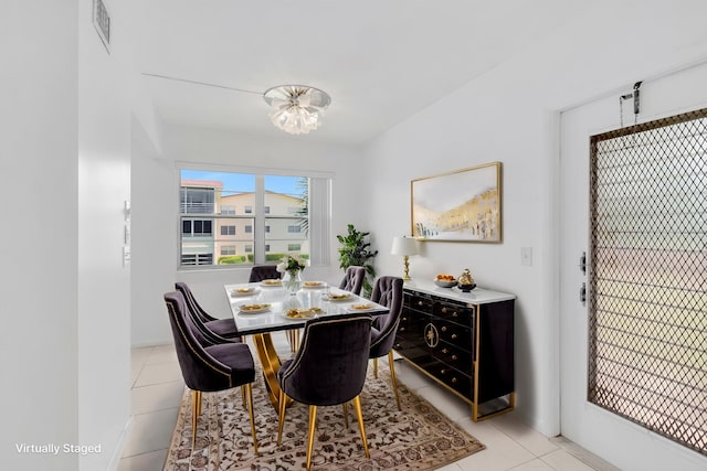 351 Preston I, Boca Raton, FL 33434 - dining space featuring light tile patterned floors and a chandelier