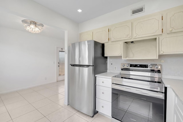 351 Preston I, Boca Raton, FL 33434 - kitchen with stainless steel appliances, light countertops, baseboards, and light tile patterned flooring