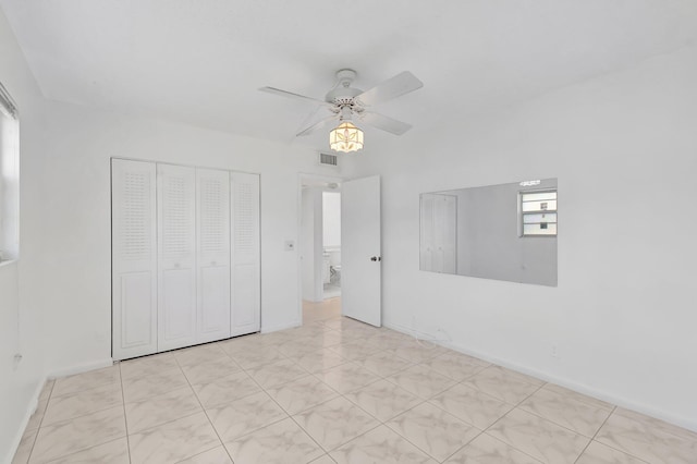 351 Preston I, Boca Raton, FL 33434 - unfurnished bedroom with a closet, ceiling fan, and baseboards