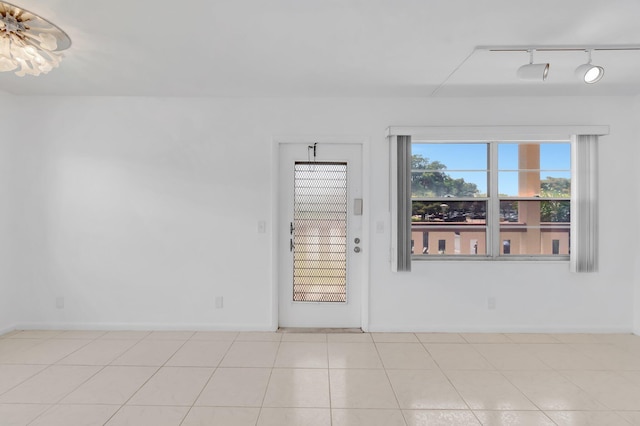 351 Preston I, Boca Raton, FL 33434 - unfurnished room featuring rail lighting and baseboards