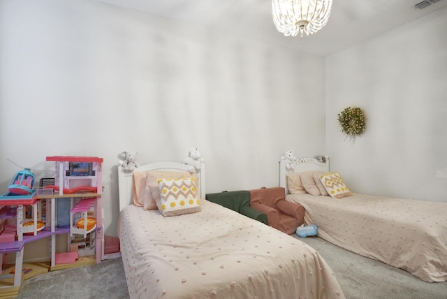 bedroom with a notable chandelier and carpet