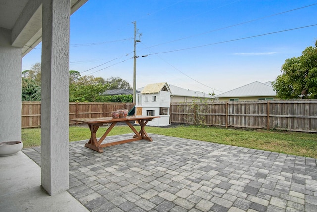 view of patio / terrace with an outbuilding