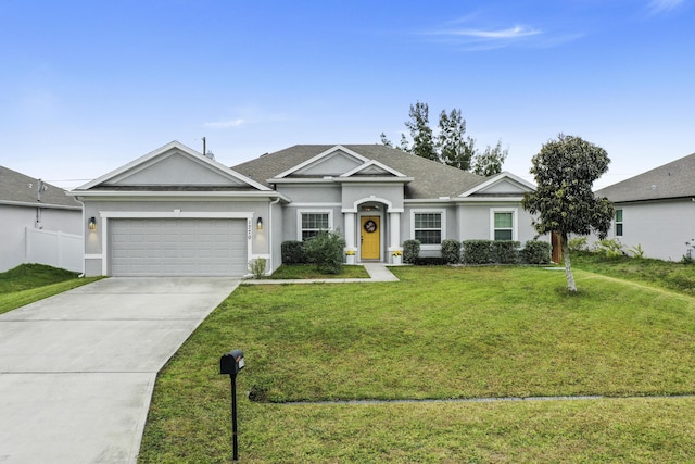 ranch-style house featuring a garage and a front lawn