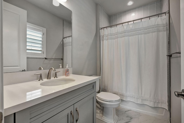 full bathroom featuring toilet, shower / bath combo, and vanity