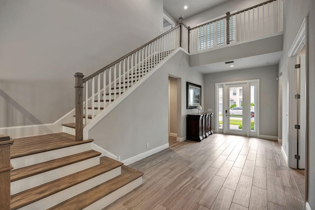 foyer with a towering ceiling