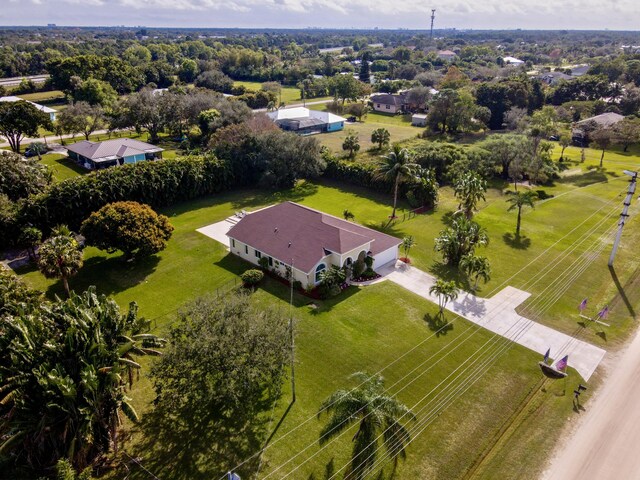 mediterranean / spanish house with a garage and a front lawn