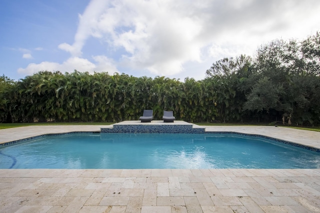 outdoor pool featuring a patio