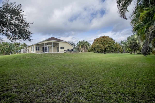 view of yard with a sunroom