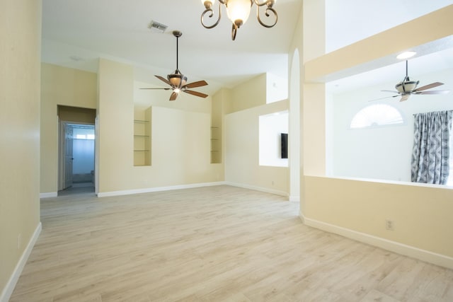 unfurnished room with high vaulted ceiling, baseboards, visible vents, and light wood finished floors