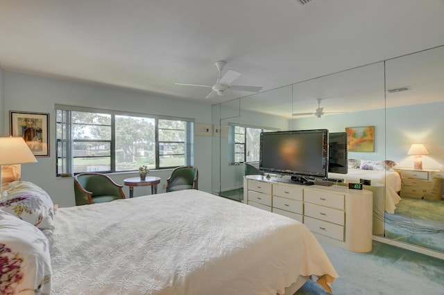 carpeted bedroom featuring ceiling fan