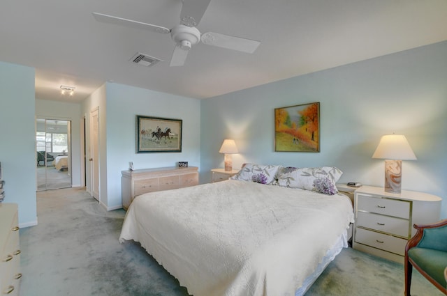 bedroom featuring ceiling fan, a closet, and light carpet