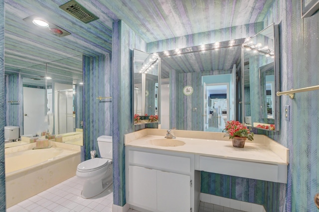 full bathroom with toilet, vanity, tile patterned flooring, and plus walk in shower