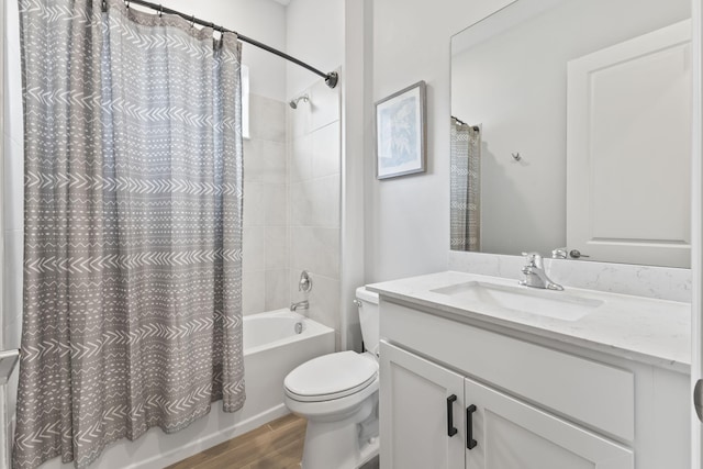 full bathroom featuring hardwood / wood-style flooring, vanity, toilet, and shower / bath combo