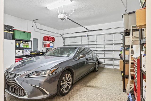 garage featuring a garage door opener and electric panel