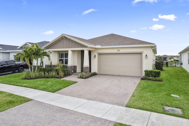 view of front of home featuring a garage and a front yard