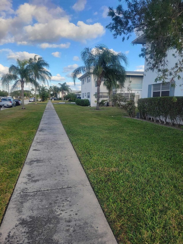 surrounding community featuring a lawn