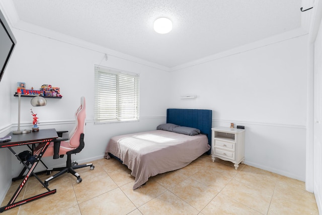 bedroom featuring light tile patterned flooring, crown molding, and a textured ceiling