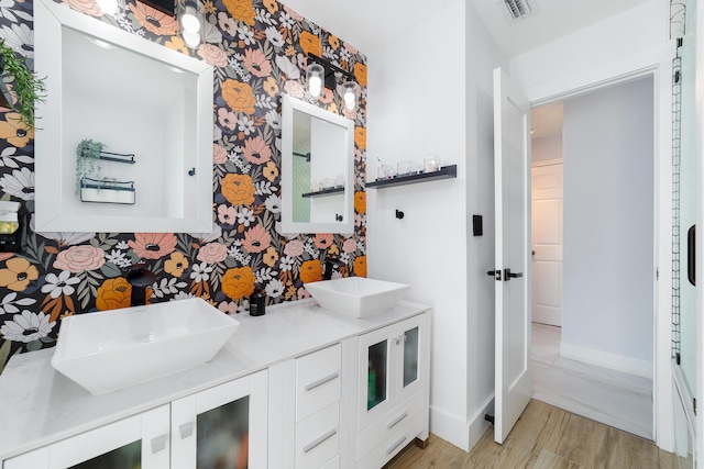 bathroom featuring vanity and hardwood / wood-style flooring