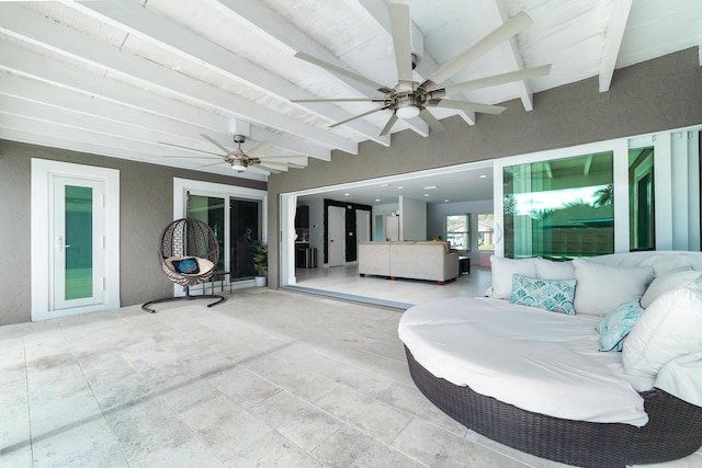 view of patio / terrace featuring ceiling fan and an outdoor living space