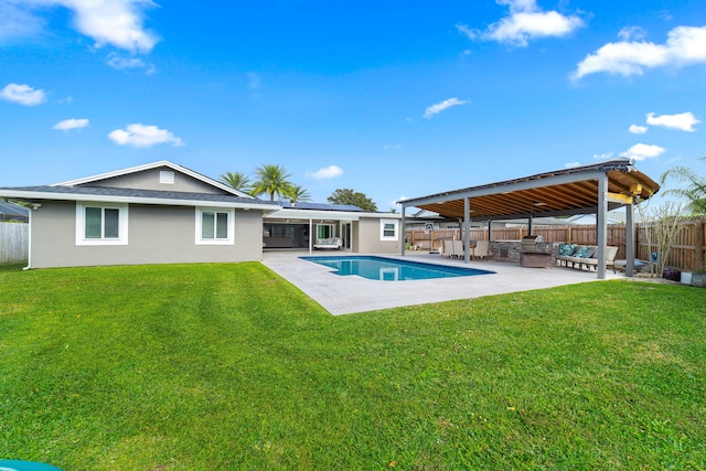 view of pool featuring a lawn and a patio