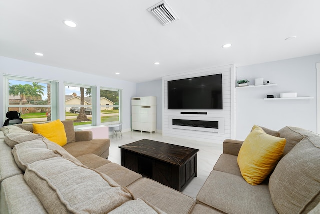 living room with a large fireplace