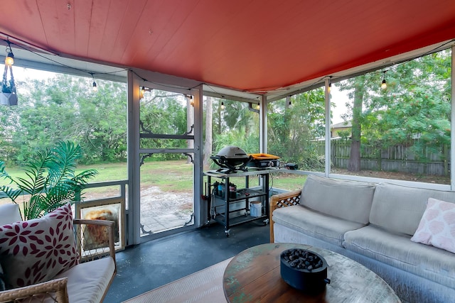 sunroom / solarium with wood ceiling and plenty of natural light