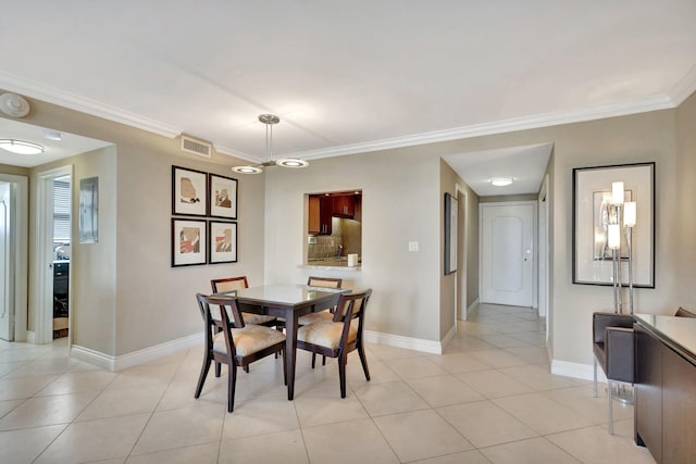 2840 S Ocean Blvd Unit 413, Palm Beach, FL 33480 - dining room featuring baseboards, crown molding, and light tile patterned floors