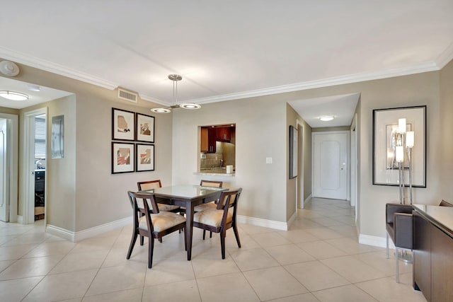 tiled dining space with crown molding