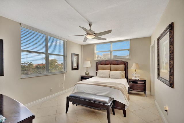 bedroom featuring light tile patterned floors and ceiling fan