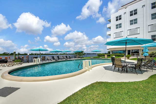 view of swimming pool featuring a patio area