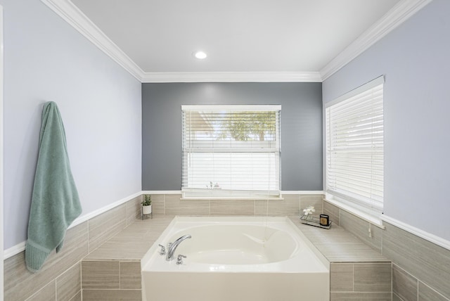 bathroom featuring crown molding and tiled bath