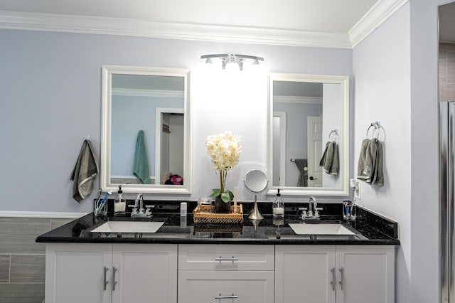 bathroom featuring vanity and ornamental molding