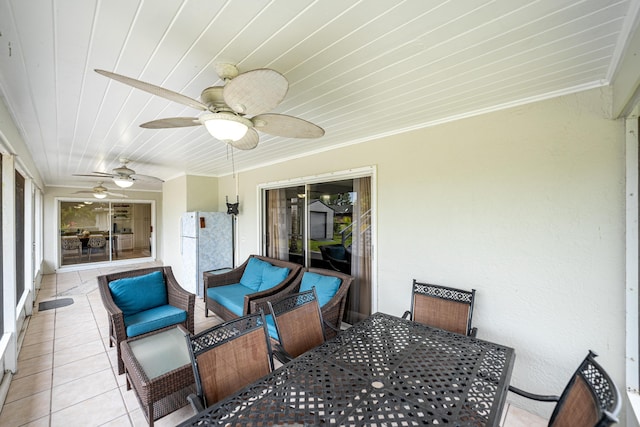 view of patio / terrace featuring ceiling fan and an outdoor living space