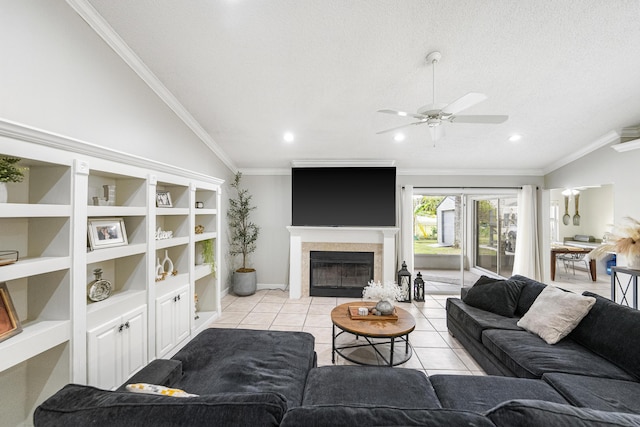 living room with a textured ceiling, lofted ceiling, built in shelves, light tile patterned floors, and crown molding