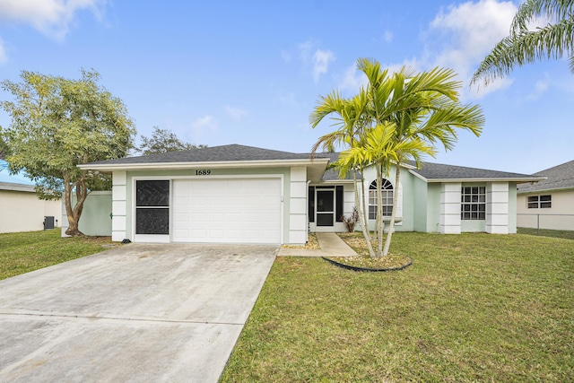 ranch-style house featuring a garage and a front lawn