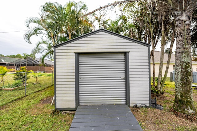 view of outbuilding featuring a lawn