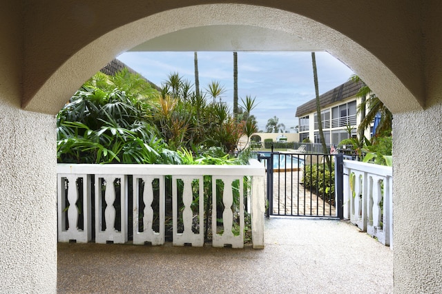 view of patio featuring a balcony