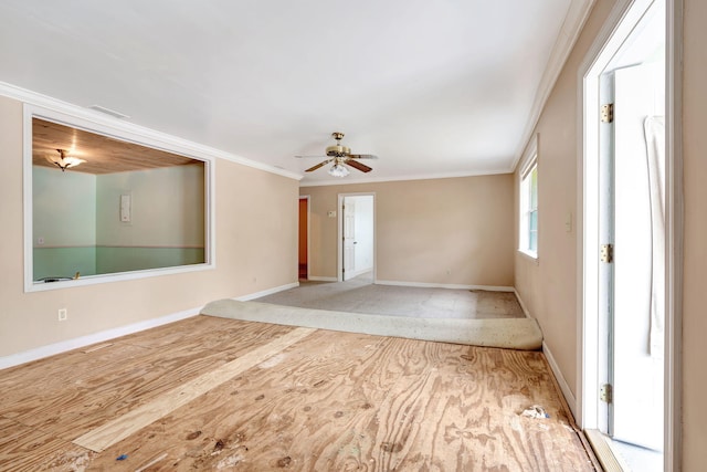 empty room with ceiling fan and ornamental molding